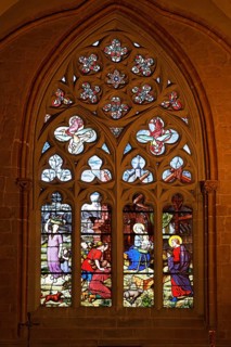 Colourful stained glass window depicting the birth of Jesus