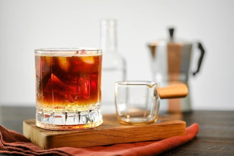 Espresso tonic on a wooden serving board