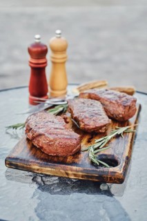 Grilled New York strip steaks outdoor