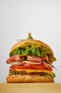 Low angle view of beef burger with bacon
