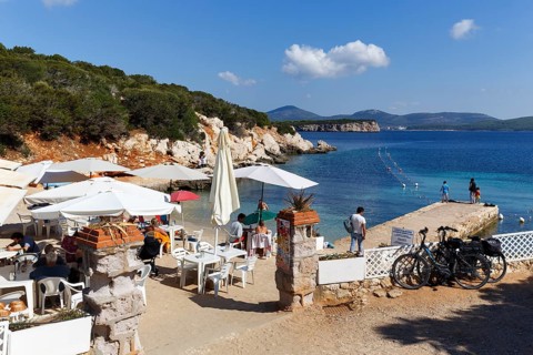 Cala Dragunara beach with beach bar