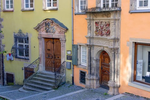 Green Stellwaghaus with staircase and orange Renaissance Widmannhaus