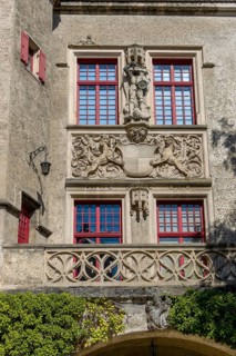 Detail of the magnificent facade with figures and coat of arms of the Hohenzollern Castle Sigmaringen