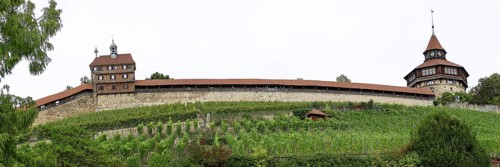 Panoramic photo of the medieval town wall with the castle wall