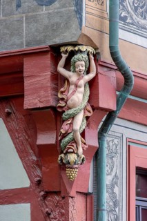 Detail of the corner of Tuebingen's historic town hall building with a carved female figure