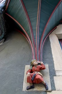 Sculpture of a little man in red clothes