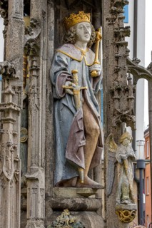 Detail with the portrait of the prince sculpture on the Gothic fountain column of the market fountain on the market square