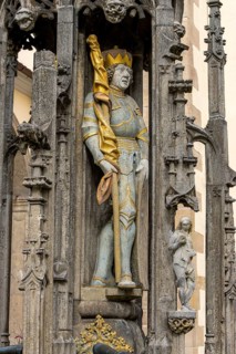 Detail with the portrait of the prince sculpture on the Gothic fountain column of the market fountain on the market square