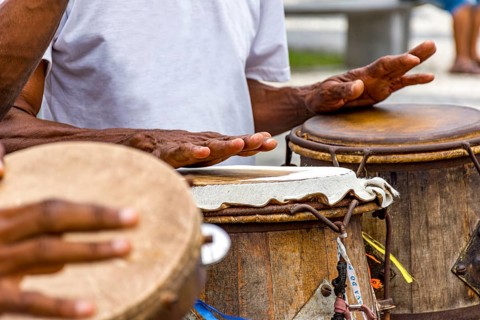 Percussionists playing their instruments during a capoeira performance in a Pelourinho square in the city of Salvador