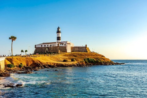 Sunset at the famous Farol da Barra in the city of Salvador