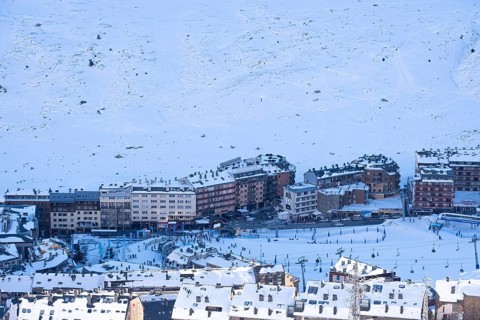 Aerial view of El Pas de la Casa in the snowy landscape in the Pyrenees mountains in Andorra