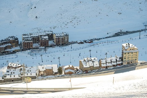 Aerial view of El Pas de la Casa in the snowy landscape in the Pyrenees mountains in Andorra