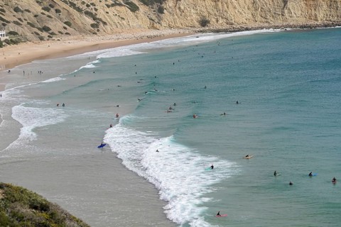 Surfers in the surf at Sagres beach