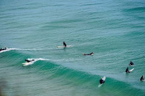 Surfers in the surf at Sagres beach