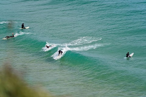 Surfers in the surf at Sagres beach