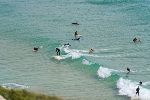 Surfers in the surf at Sagres beach