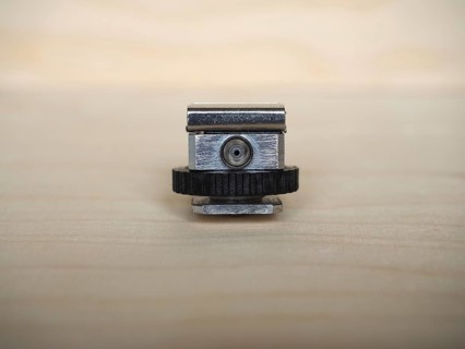 Camera hot shoe adapter