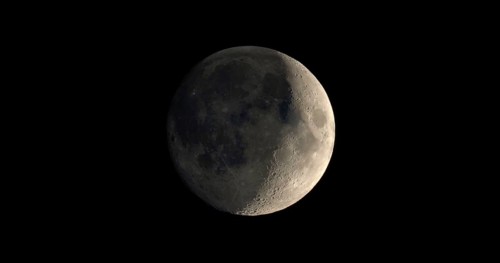 Waxing crescent moon seen with telescope