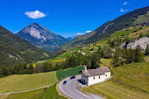Summer landscape with Saint-Laurent chapel on the ascent to the Great St Bernard Pass