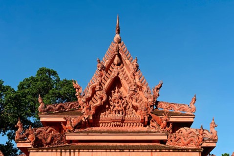 Pediment of the Buddhist Wat Sila Ngu temple with figurative decorations from Buddhist mythology