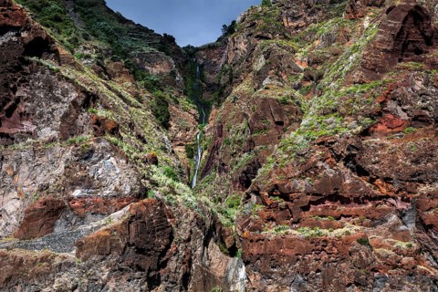 Volcanic cliff with waterfall