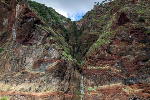 Volcanic cliff with waterfall