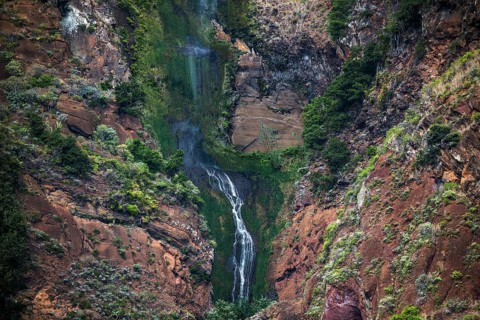 Volcanic cliff with waterfall