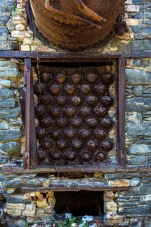 Rusted pressure vessel and bolts on a disused factory site