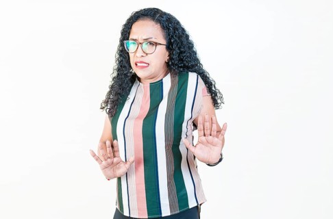 Afro woman with face disgusted on isolated background.. Woman in glasses with disgust face isolated