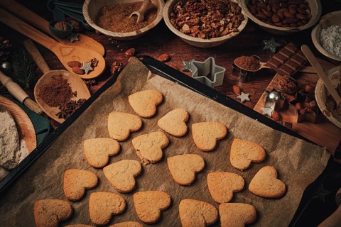 Heart-shaped biscuits baked on a baking tray