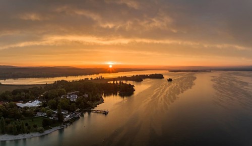 Aerial panorama of western Lake Constance at sunrise with the Mettnau peninsula