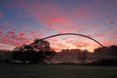 Bridge over the river Mulde near Dessau-Rosslau in the morning with atmospheric cloudy sky