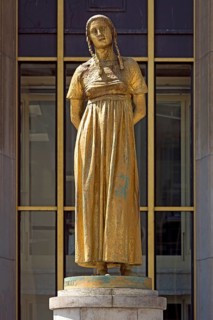 Golden female statue by Felix Alexandre Desruelles