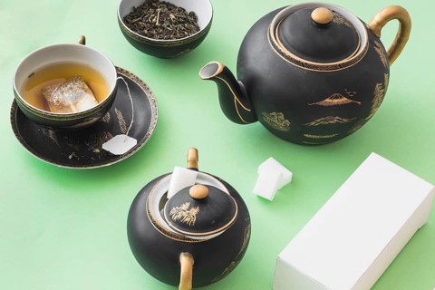 Herbal tea set with white box green paper background