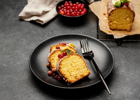 High angle cake slices plate with fork berries