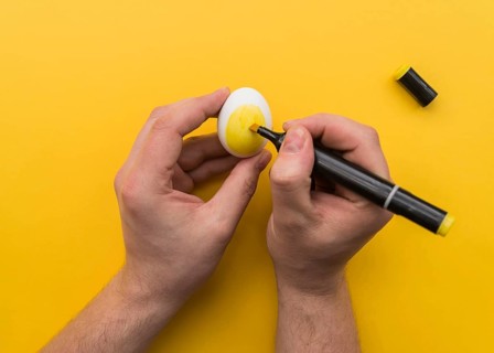 Man drawing egg