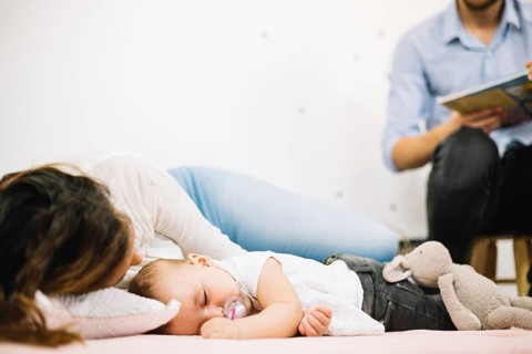 Mother sleeping floor with baby