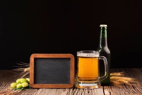 Mug bottle beer wooden background