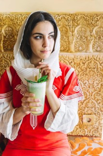 Muslim woman with delicious drink