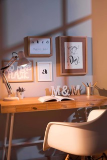 Neat organised workspace with chair lamp
