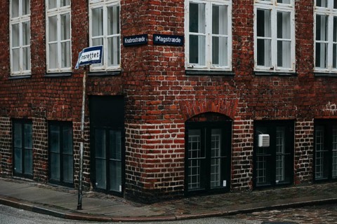 Old building corner paved street