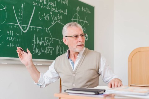 Old teacher explaining lecture room