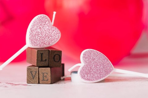 Ornament candles symbol heart near love title wooden wands