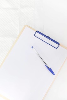 Pen white paper clipboard against white background