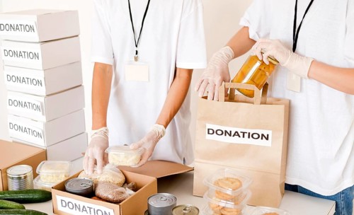 People preparing food box bag donation