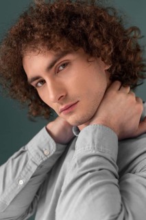 Portrait curly haired young man 6