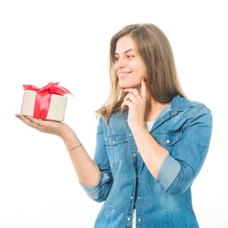 Portrait happy woman looking gift white background