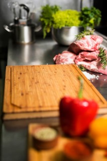 Raw meat steaks with wooden board table
