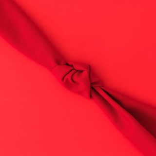 Red knot fabric bright background