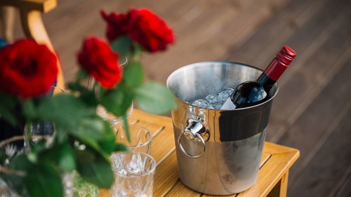 Roses wine bottle ice bucket table